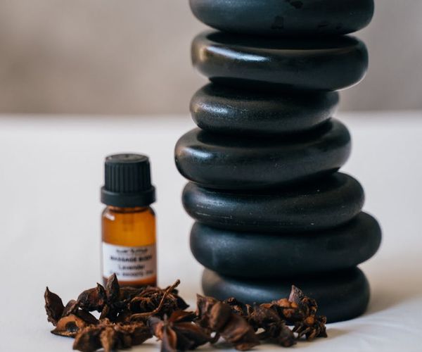 Stack of smooth zen stones on a blurred natural background.